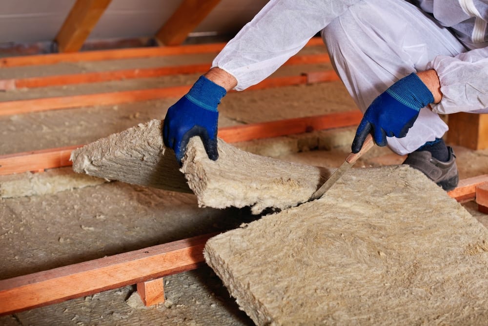 Cutting And Laying Attic Insulation